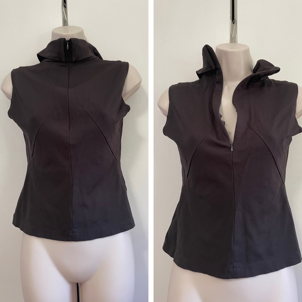 All black with no sleeves and nice collar.